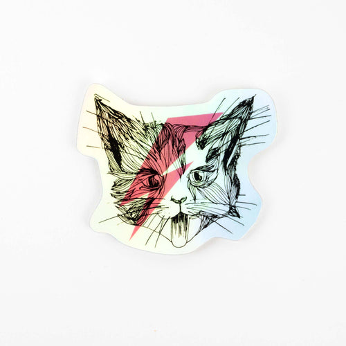 A colorful vinyl sticker of a cat with a lightning bolt design on one side, featuring black, pink, and teal colors.
