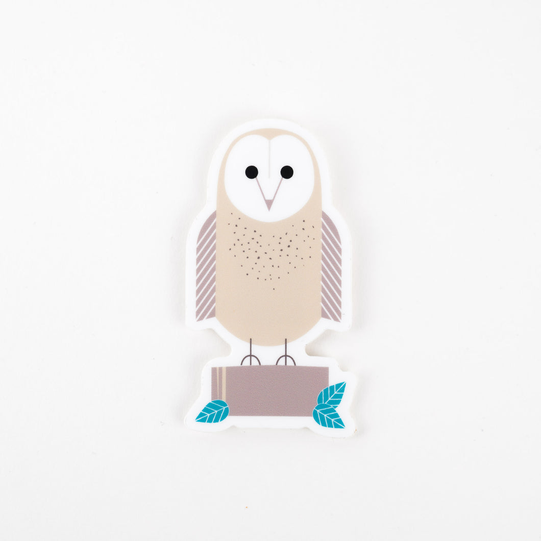 A sticker depicting a modern owl with a beige body and blue and green details 