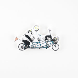 Panda, bunny, bird, ostrich and dog riding a tandem bicycle with balloons on a white background